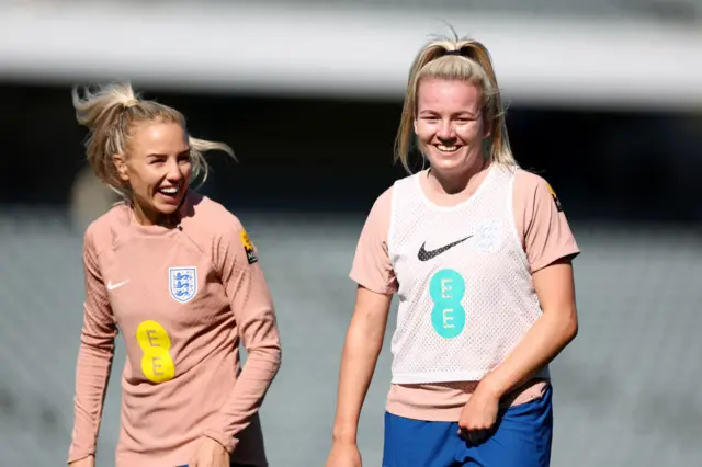 Alex Greenwood and Lauren Hemp share a laugh in training.