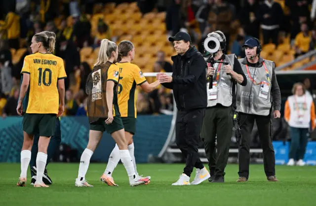 Tony Gustavsson commiserates with the Australia players.