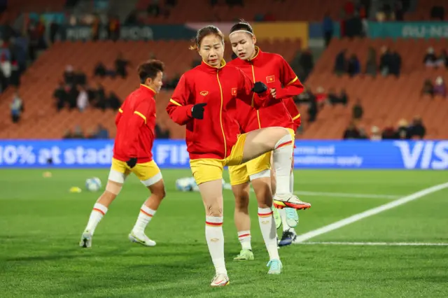 Vietnam players go through their paces ahead of kick off.