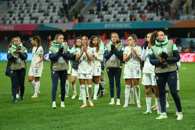 Portugal players do a lap of appreciation after their first game defeat.