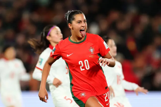 Kika Nazare sticks her tongue out with glee after scoring.