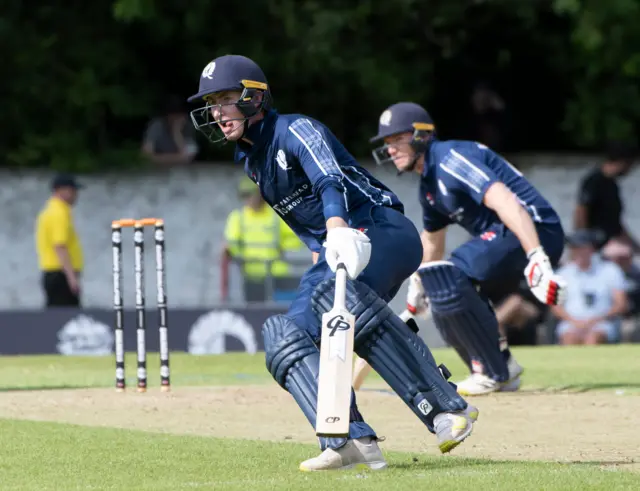 Brandon McMullen and Richie Berrington run between the wickets