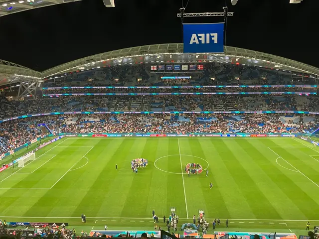 England and Denmark player huddles