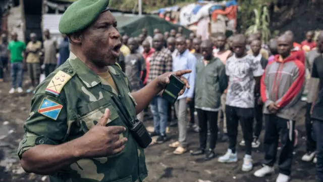 A Congolese military officer leads a session to enrol new recruits into the army to go to the front against the M23 (March 23 Movement) rebellion, in Goma, on November 7, 2022.