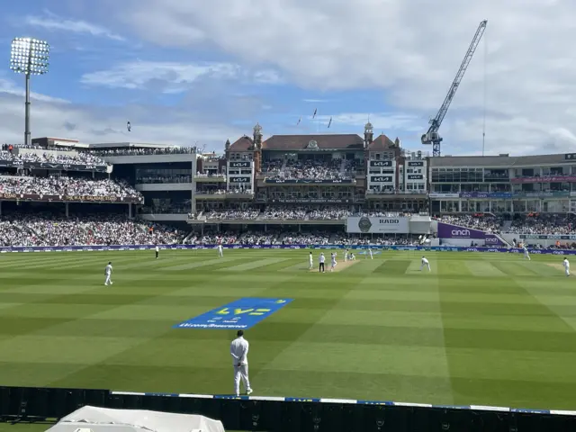 England fielder behind bowlers arm