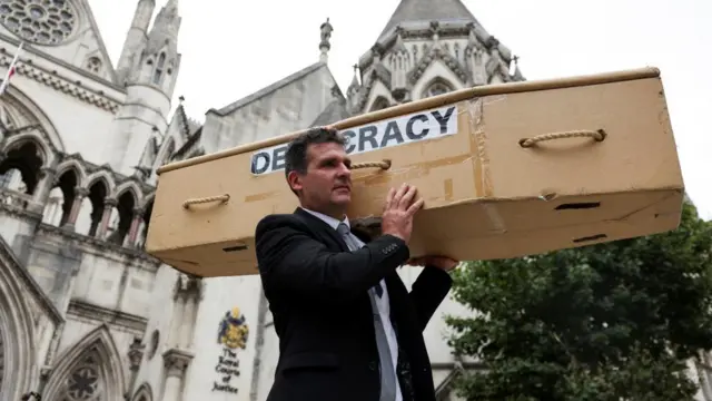 Coffin anti-Ulez demonstrator outside court