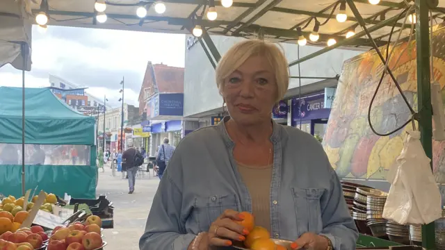 Caroline at her fruit stall