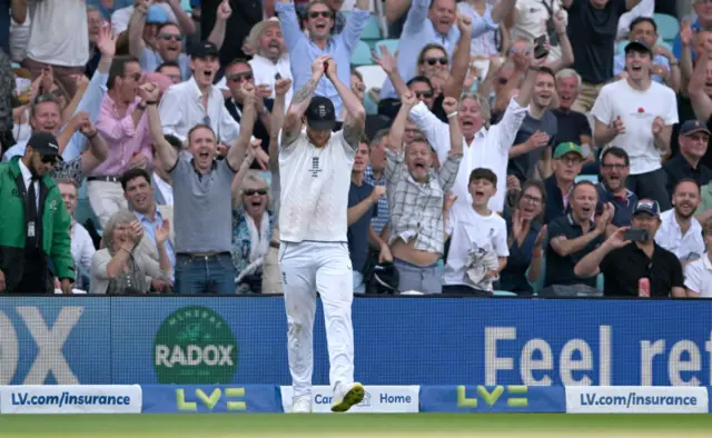 Ben Stokes celebrates his boundary catch to dismiss Pat Cummins