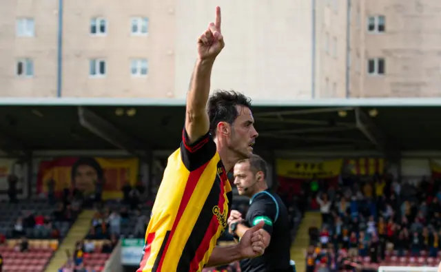 Partick Thistle's Brian Graham celebrates his late winner from the spot