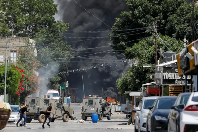 Israeli armoured vehicles among the smoke and chaos in Jenin