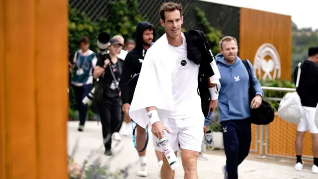 Andy Murray walks through the WImbledon grounds