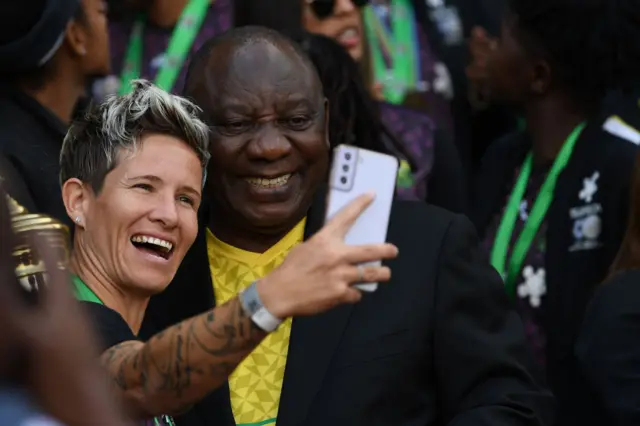 President Cyril Ramaphosa take a selfie with South Africa captain Janine van Wyk during the South Africa women's national soccer team trophy celebration with President Cyril Ramaphosa at Union Buildings on July 27, 2022