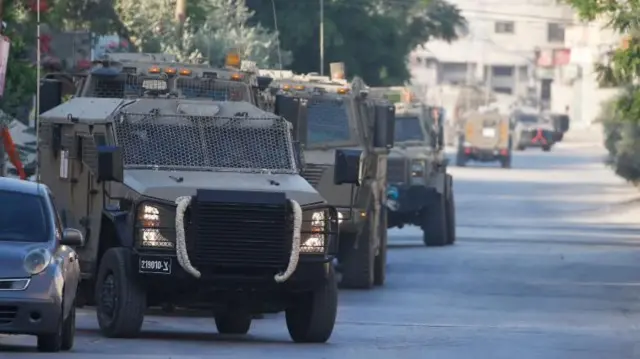 Israeli military vehicles manoeuvre during a raid in Jenin