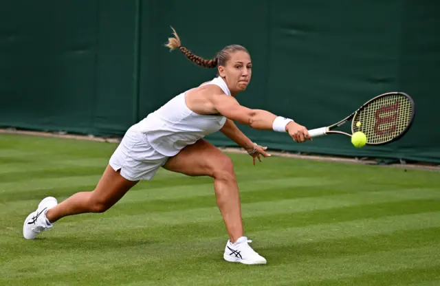 Diane Parry stretches to reach a backhand