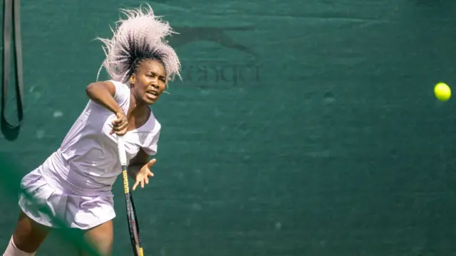 Venus Williams serves in a Wimbledon practice session