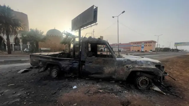 A burned vehicle is seen in Khartoum, Sudan April 26, 2023