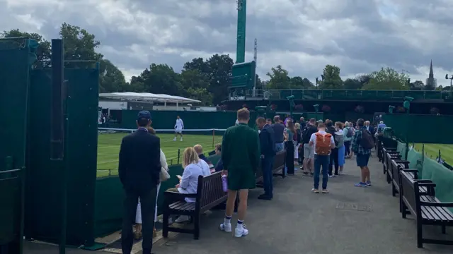 People gather to watch action on court