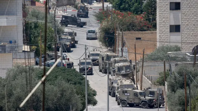 A view of Israeli armoured fighting vehicles at a road during an Israeli military operation in Jenin