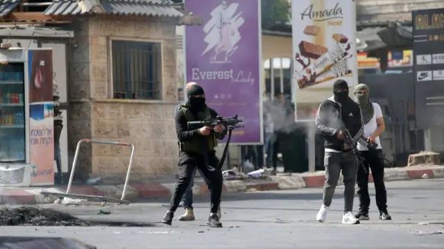 Palestinian militants engage in a firefight with the Israeli military in Jenin,