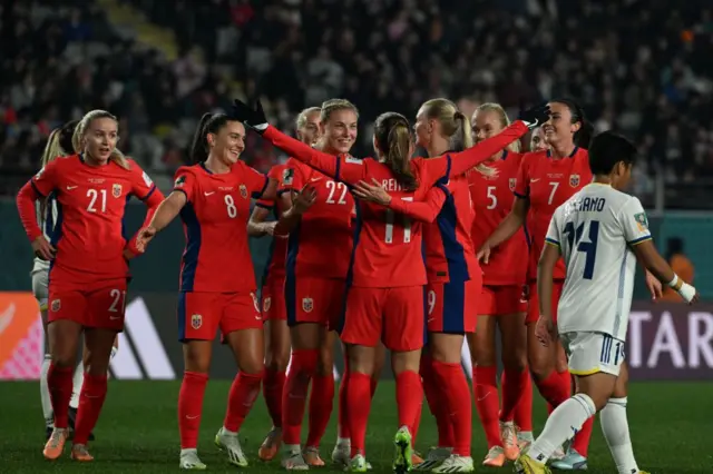 Norway players celebrate their sixth.