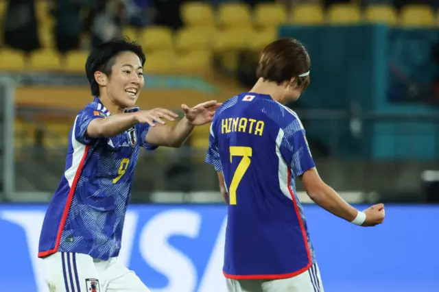 Miyazawa pist pumps in celebration of scoring the opening goal.