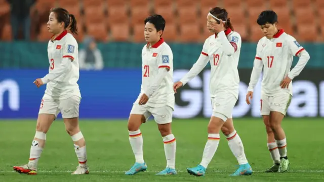 Vietnam players look dejected after defeat