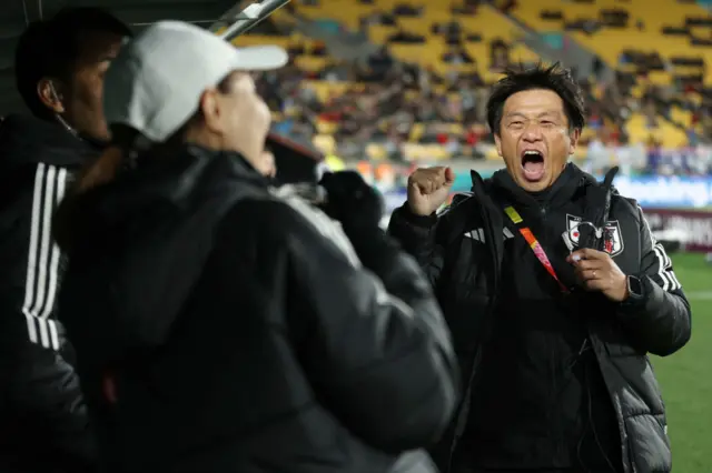 Nishiiri shouts in delight after his side score again.