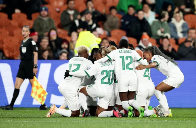 Zambia players celebrate their first goal of the tournament.