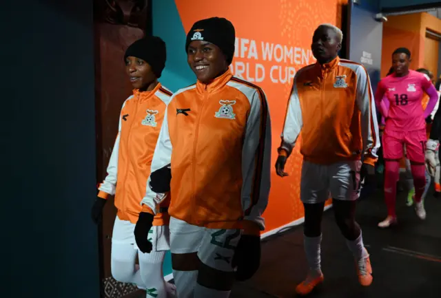 Zambia players go out to warm up.