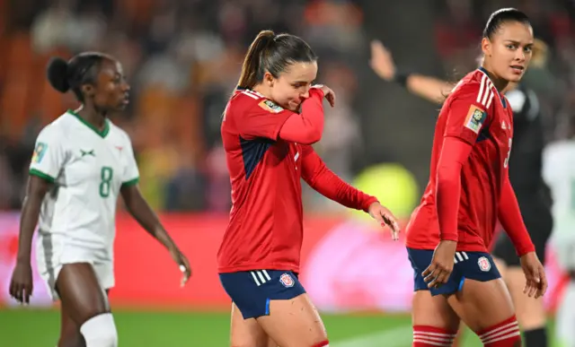 Herrera wipes her face after being denied a second goal.