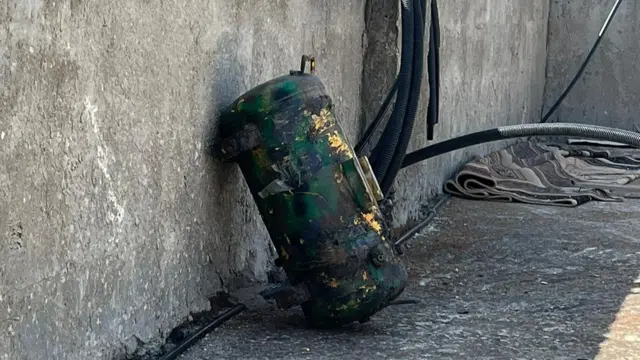 Alleged IED placed by a concrete wall