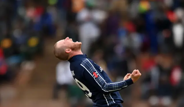 Michael Leask celebrates