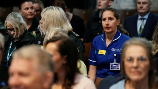 NHS staff members attend the NHS anniversary ceremony at Westminster Abbey