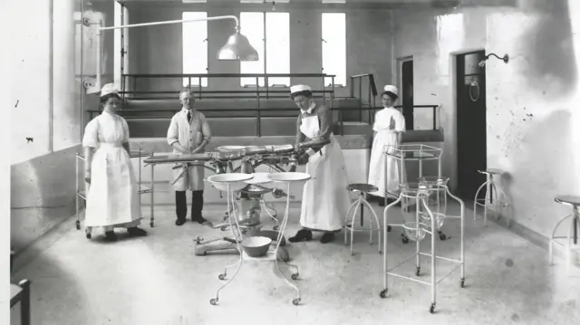 Doctors and nurses in the operating theatre at King's College Hospital in 1914