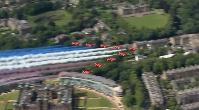 The Red Arrows fly over the Palace of Holyroodhouse