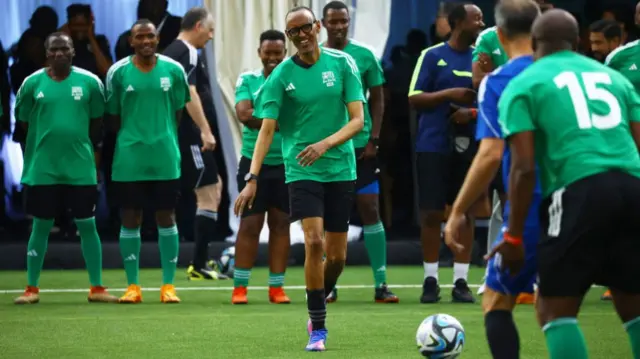 Rwandan President Paul Kagame takes part in a football match