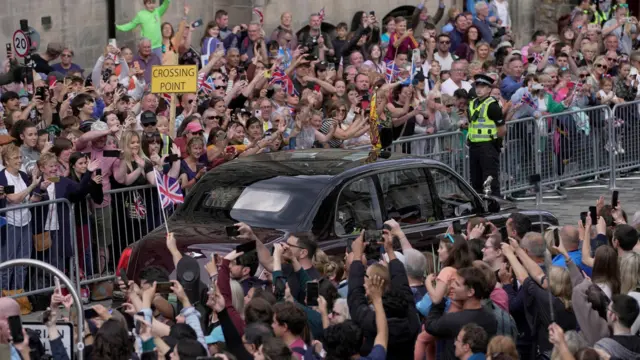 Crowd on the Royal Mile as royal procession passes