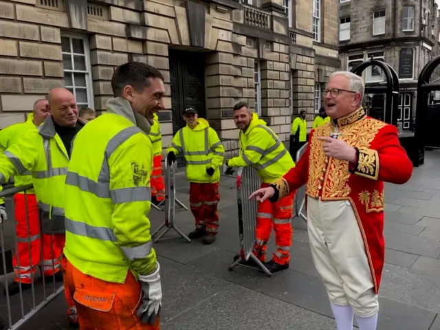 Dr Joe Morrow chats with workers in Edinburgh