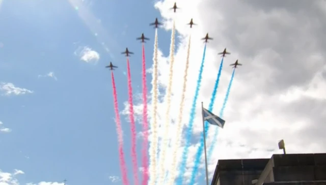 The Red Arrows fly over the Palace of Holyroodhouse