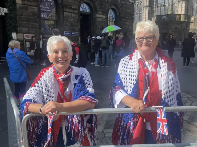 Two keen royalists have secured a good spot for today's processions