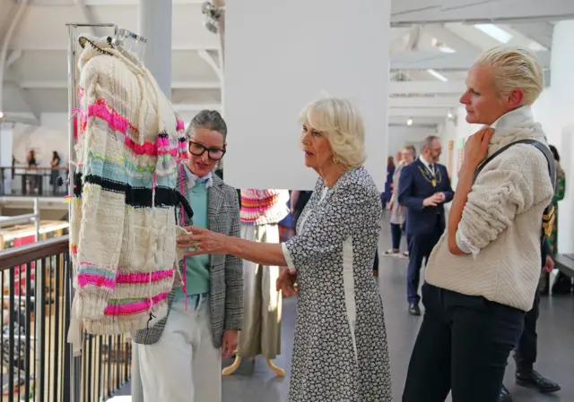 Queen Camilla visits Dovecot studios in Edinburgh to meet weavers, staff and local crafts people