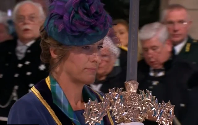 Dame Katherine Grainger holds up the Elizabeth sword