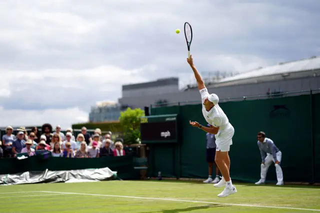 Hubert Hurkacz rising high to serve