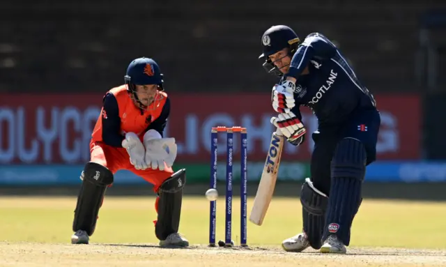 Richie Berrington drives through the covers