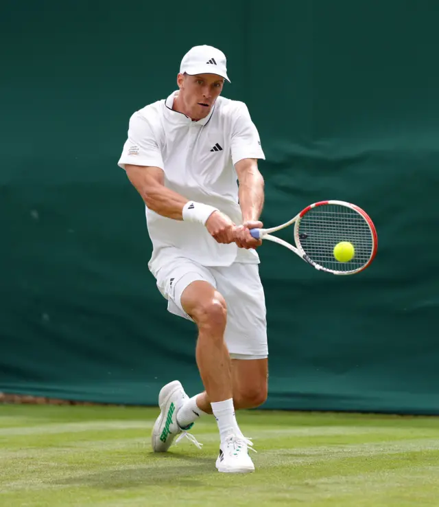 Jan Choinski hits a backhand