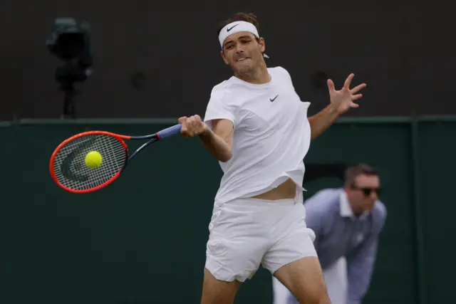 Taylor Fritz hits a forehand