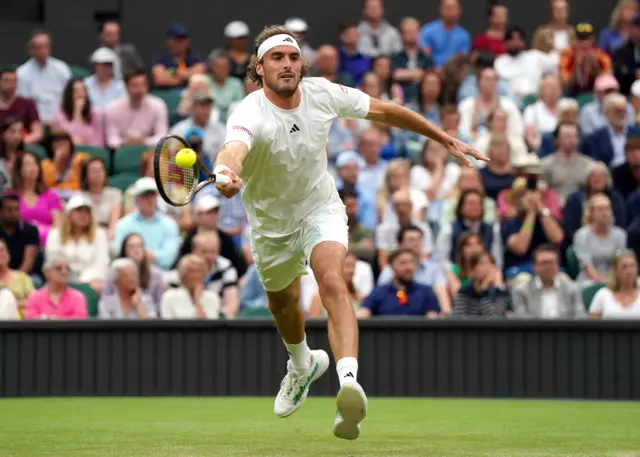 Stefanos Tsitsipas reaching for a forehand