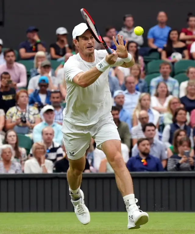 Andy Murray volleys a forehand