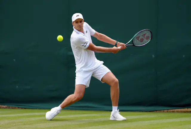 Hubert Hurkacz preparing to hit a backhand