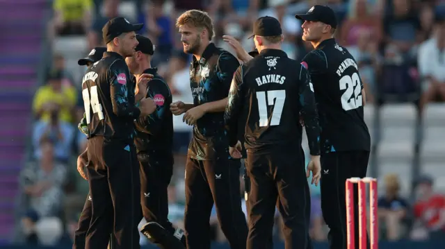 Adam Finch celebrates taking a wicket